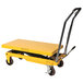 A yellow Wesco Industrial Products scissors lift table with black wheels.