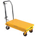 A yellow Wesco lift table with wheels.