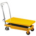A yellow Wesco scissor lift table with wheels.