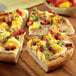 A pizza with bacon and cheese on a Rich's Fresh N Ready pizza crust.