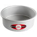 A silver round Fat Daddio's cake pan with a red and white label.