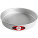 A round silver pan with a red and white label.
