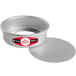 A round silver pan with a red label.