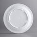 A white plate with a narrow rim and a circular design.