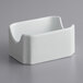A white porcelain sugar caddy with a square shape.