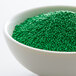 A bowl of green nonpareils.