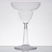 A clear plastic margarita glass with a clear stem.