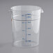 A Vigor clear polycarbonate food storage container with blue gradations and a clear plastic measuring cup.