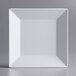 An Acopa Rittenhouse white square melamine plate with a square edge on a white surface.
