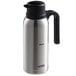A stainless steel Thermos carafe with a black handle.