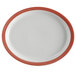 A white porcelain oval platter with a narrow coral and blue rim.