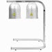 An Avantco silver free standing heat lamp with two white bulbs with yellow triangle signs.