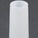 A white cylindrical object with a black handle.