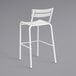 A white powder coated aluminum outdoor barstool with a backrest.