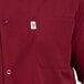 A close up of a burgundy Uncommon Chef cook shirt.