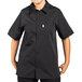 A person wearing a black Uncommon Chef short sleeve cook shirt.