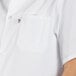 A person wearing a Uncommon Chef white cook shirt.