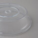 A Carlisle clear polycarbonate plate cover with a circular hole.