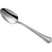 An Acopa Sienna stainless steel teaspoon with a long silver handle and a silver spoon.