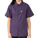 A woman wearing an Uncommon Chef eggplant purple cook shirt.