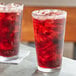Two glasses of Boylan Creamy Red Birch Beer with ice sitting on a table.