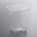 A Fabri-Kal clear plastic square deli container with a lid.