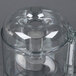 A clear plastic Robot Coupe cutter bowl with a white lid.