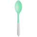 A green and white Pearl to Green color-changing dessert spoon.