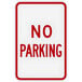 A white sign with red text that says "No Parking"