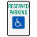 A green and white reserved parking sign with a wheelchair symbol and text that reads "Handicapped Reserved Parking"
