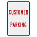 A white sign with red text that says "Customer Parking"