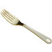 A close up of a Visions gold plastic fork with a white background.