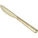 A Visions Hammersmith gold plastic knife with a handle.