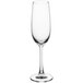 An Acopa Covella flute glass with a stem on a white background.