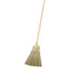A Carlisle 4-stitch heavy-duty warehouse corn broom with a wooden handle.
