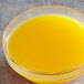 A glass bowl of Les Vergers Boiron Mandarin Orange 100% Fruit Puree.