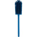 A Carlisle blue bottle cleaning brush with a long round handle.
