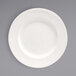 A Front of the House Catalyst Classic European White porcelain plate with a round white rim.