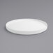 A Front of the House bright white porcelain plate with a raised rim on a gray surface.