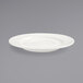 A white Front of the House porcelain saucer with a black border on a gray surface.