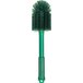 A green Carlisle Sparta multi-purpose cleaning brush with a green handle.