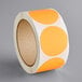 A roll of Lavex orange and white round inventory labels.