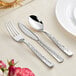 A Visions Hammersmith silver plastic cutlery set with a spoon and knife on a table.