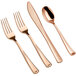 A close-up of a rose gold Visions Classic spoon, fork, and knife.