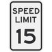 A black aluminum parking lot sign with a white background and black text that says "Speed Limit 15"