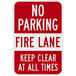 A red and white diamond grade aluminum sign that says "No Parking / Fire Lane / Keep Clear At All Times" with white text.