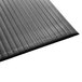 A black Guardian anti-fatigue floor mat with a black surface.