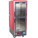 A red and silver Metro C5 heated holding and proofing cabinet with clear Dutch doors.