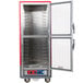 A red and silver Metro C5 heated holding and proofing cabinet with clear Dutch doors open.