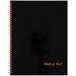 A Black n' Red matte black twinwire notebook with red writing on the cover.